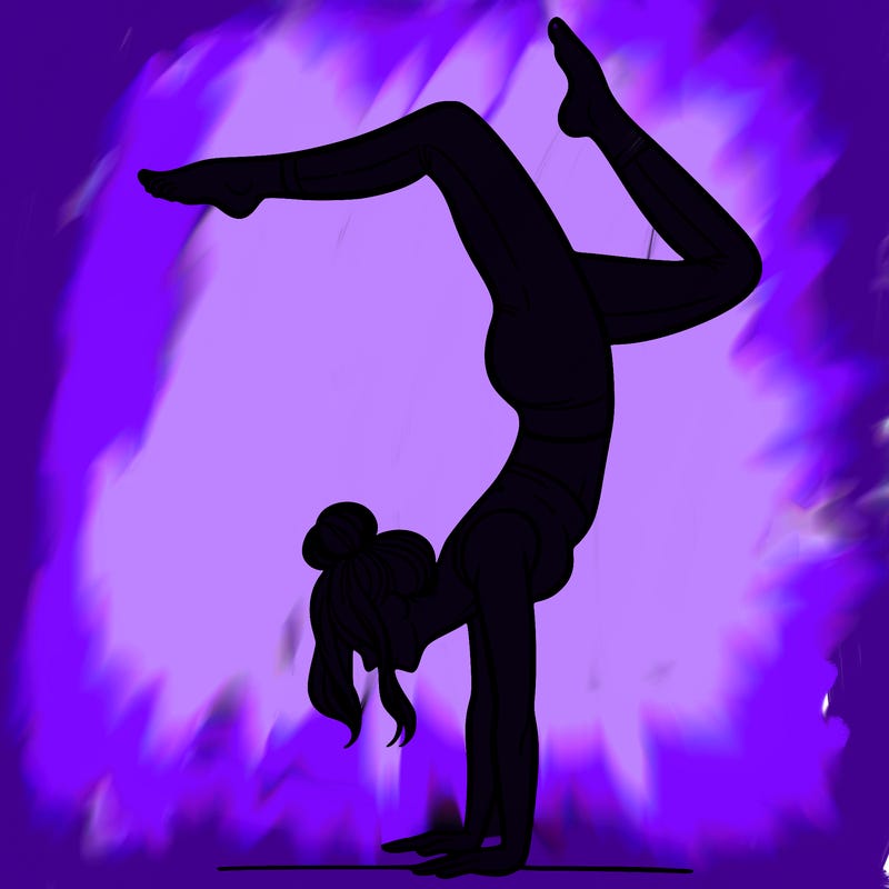 a woman doing a handstand
