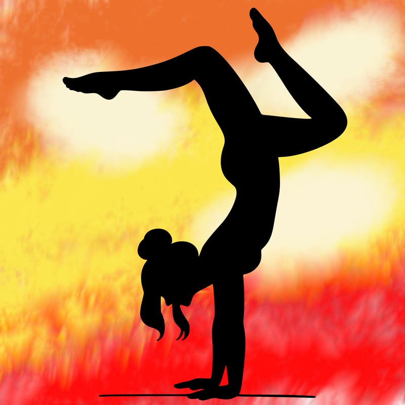 a woman doing a handstand