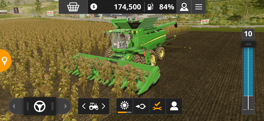 Farming Simulator 20 - A green John Deere harvester working in a sunflower field in Farming Simulator 20
