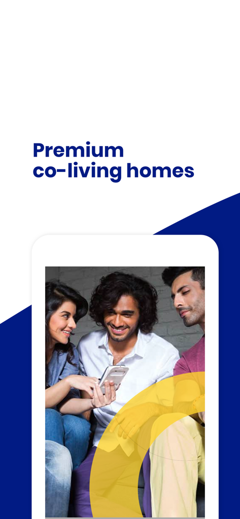 Hello World Homes - Three young adults smiling and looking at a phone screen in a premium co-living home