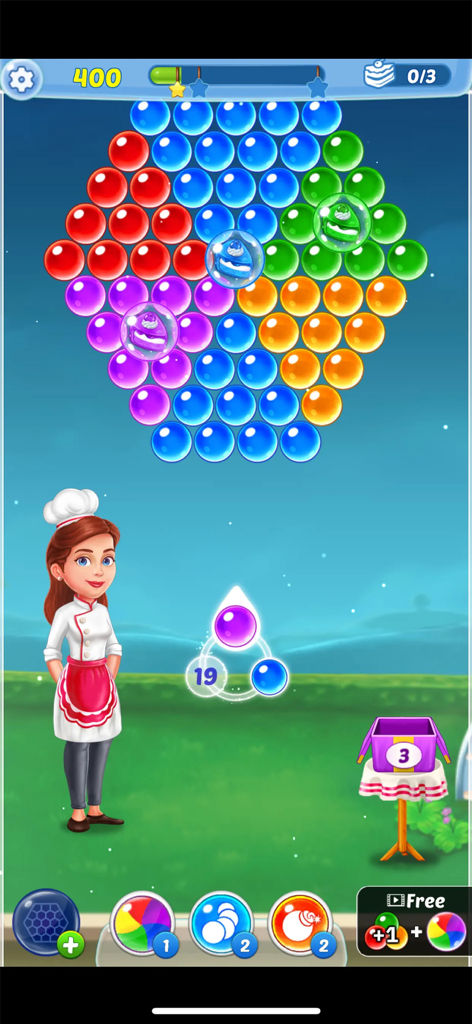 Bubble shooter gameplay screen featuring colorful bubbles and a female chef character
