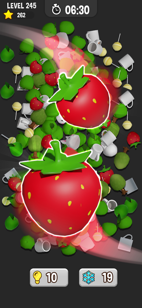 Match Pair 3D - Matching Game - Gameplay of Match Pair 3D showing a matching pair of shiny strawberries amidst a pile of 3D objects.