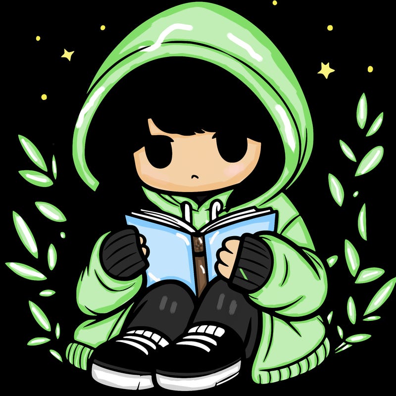 girl in oversized hoodie reading a book