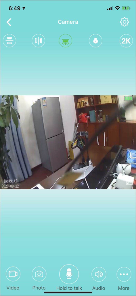 HDWiFiCamPro app interface showing a live security camera feed in a room