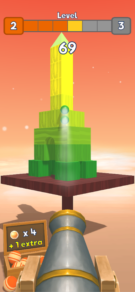 게임 Knock Balls에서 높은 블록 구조물을 조준하고 있는 은색 대포