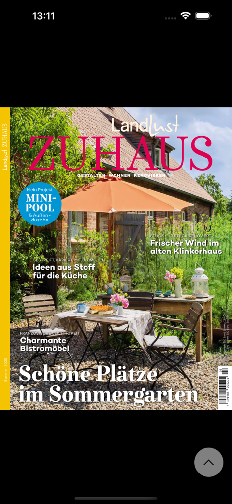 Landlust - Cover of Landlust Zuhaus magazine featuring a rustic summer garden with bistro furniture and an orange parasol