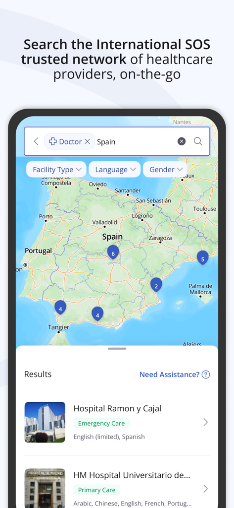International SOS app map interface searching for doctors and medical facilities in Spain.