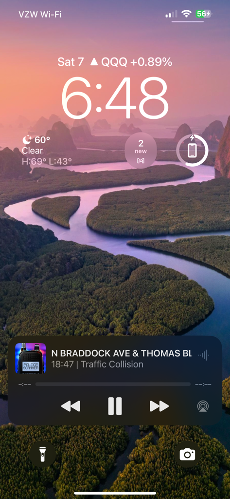 Police Scanner + Fire Radio - Police Scanner app playing a live traffic collision feed in the background on an iPhone lock screen.
