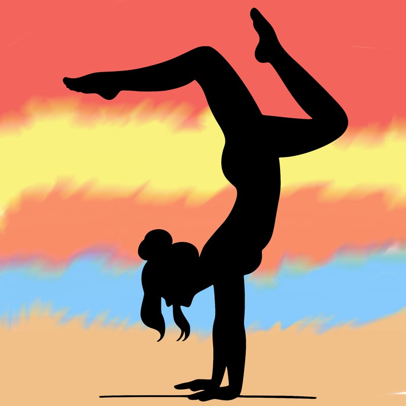 a woman doing a handstand