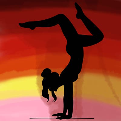 a woman doing a handstand