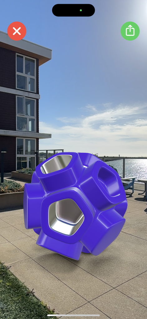 Valence 3D - A purple 3D geometric model rendered in augmented reality on an outdoor patio using Valence 3D.