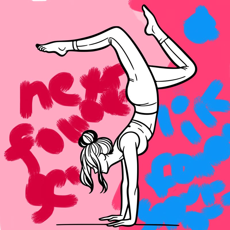 a woman doing a handstand