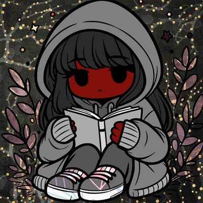 girl in oversized hoodie reading a book