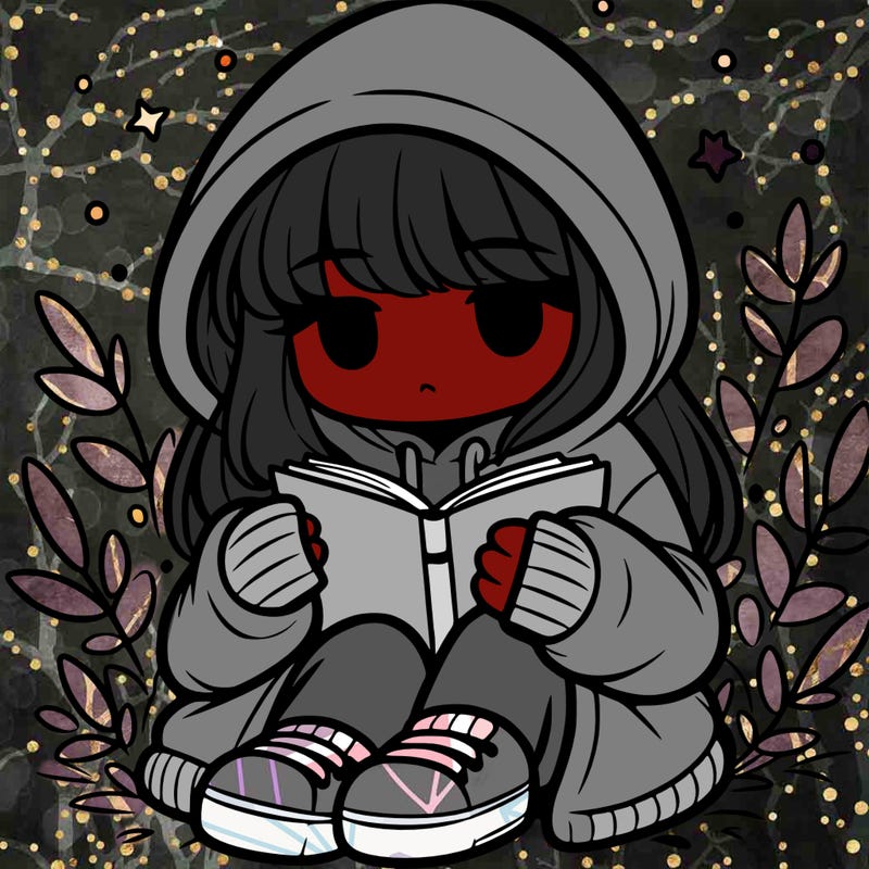 girl in oversized hoodie reading a book