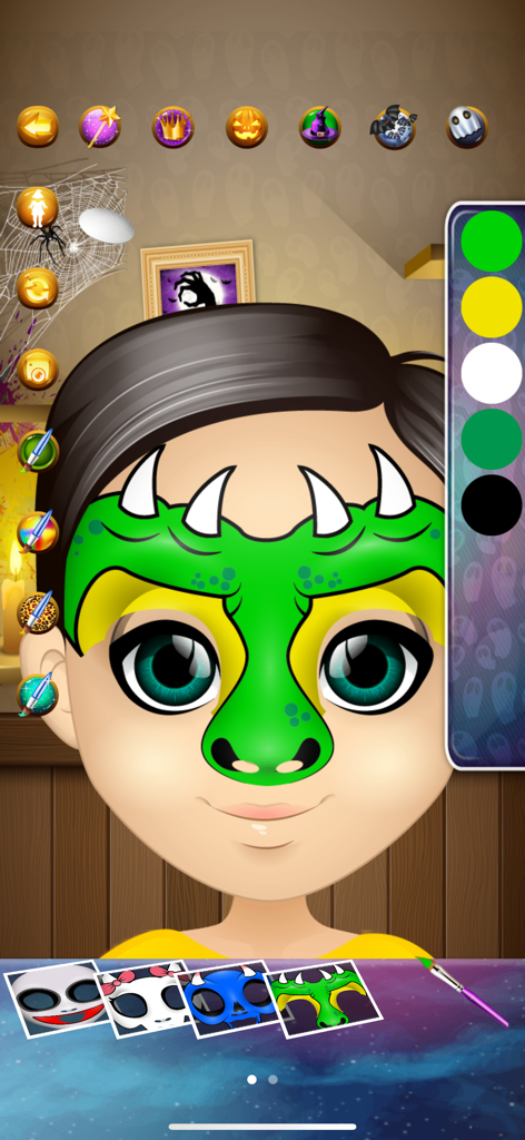 Halloween Face Paint Salon - メイクアップツールを表示するハロウィーンフェイスペイントサロンアプリで、緑のドラゴンのフェイスペイントをした子供