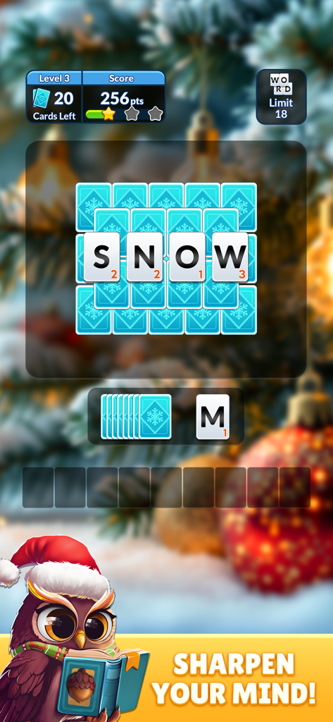 Wordscapes Solitaire Word Game - Wordscapes Solitaireのゲームプレイ。文字カードが「SNOW」という単語を形成しており、お祝いの冬の背景とかわいいフクロウのキャラクターが描かれています。