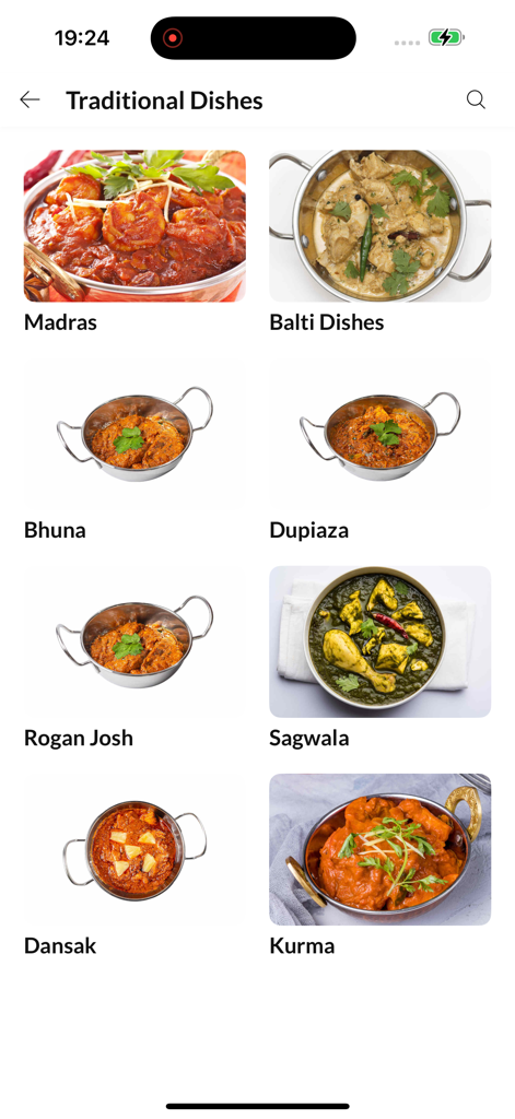 Kismet Hartshill - Una pantalla de la app móvil que muestra una variedad de platos indios tradicionales como Madras y Kurma de Kismet Hartshill.