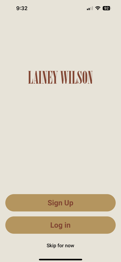 Lainey Wilson - Lainey Wilson official app login and signup screen with brown action buttons