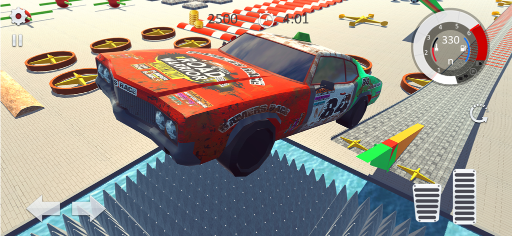 A muscle car jumping over a spike pit in a stunt arena obstacle course