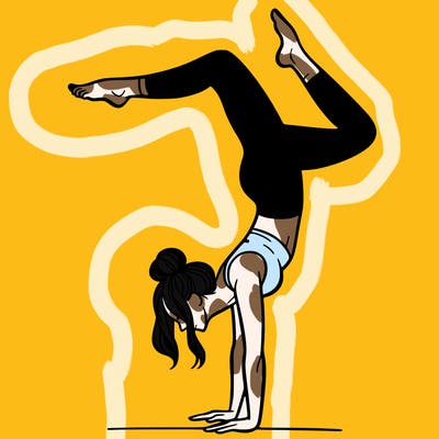 a woman doing a handstand