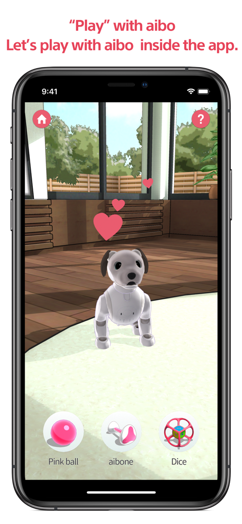 Una pantalla de smartphone mostrando el modo de juego virtual de la aplicación My aibo con un perro robot y opciones de juguetes
