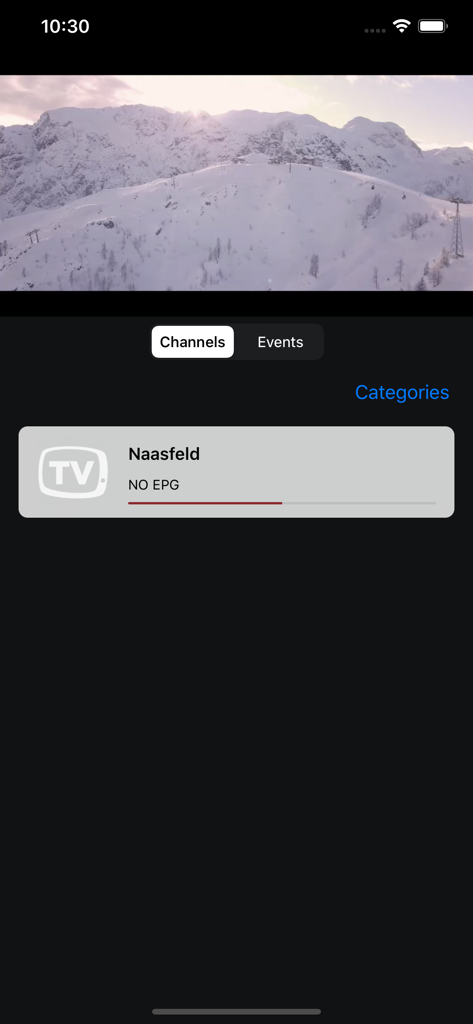 moTV.eu app interface showing a live video stream of a snowy mountain above a channel selection menu