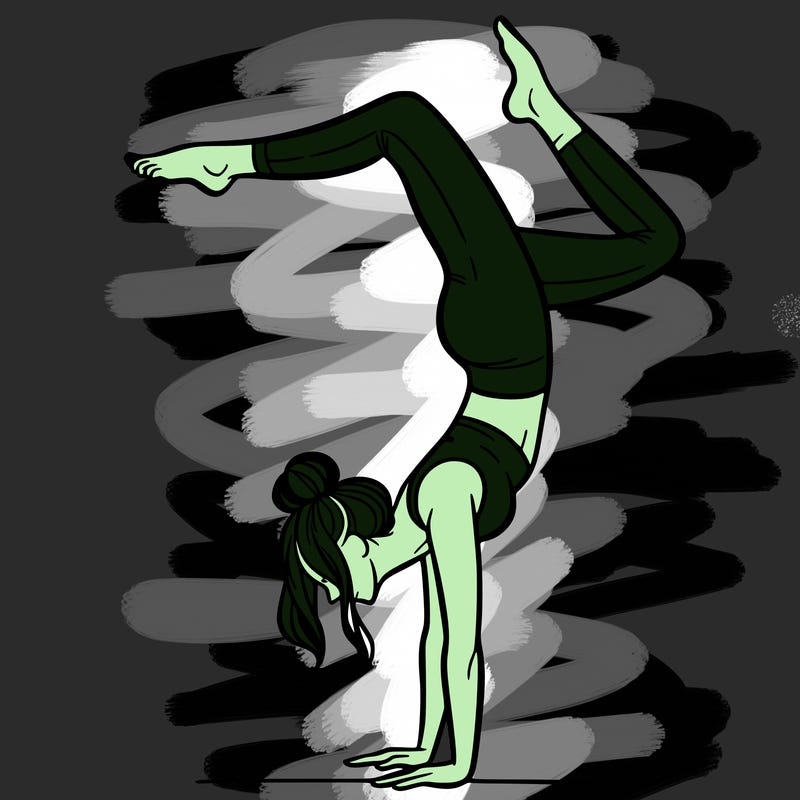 a woman doing a handstand