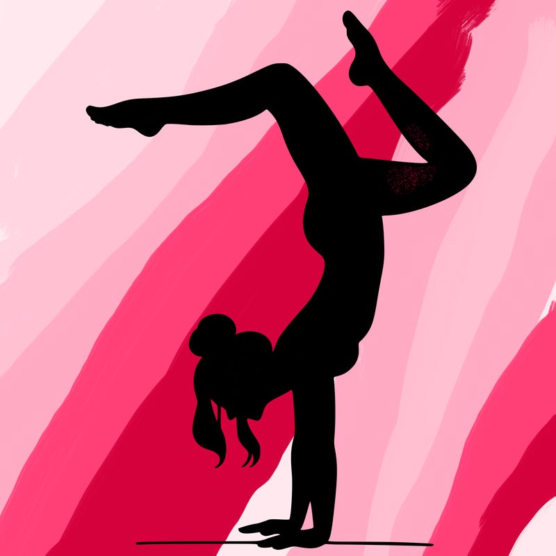 a woman doing a handstand