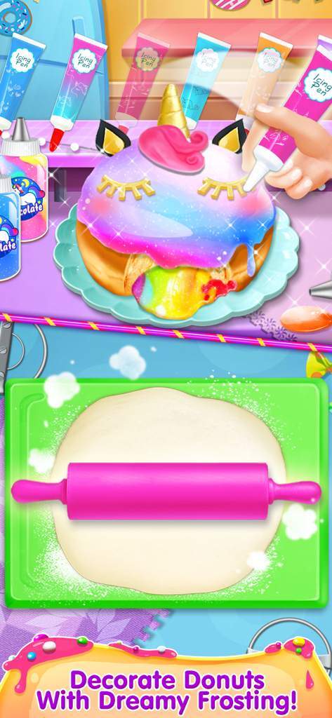 Donut Maker - Cooking Games! - A decorated unicorn donut with rainbow frosting and a hand using an icing pen above a pink rolling pin on dough.
