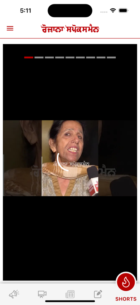 Rozana Spokesman - Mobile screen showing a Punjabi news video interview on the Rozana Spokesman app