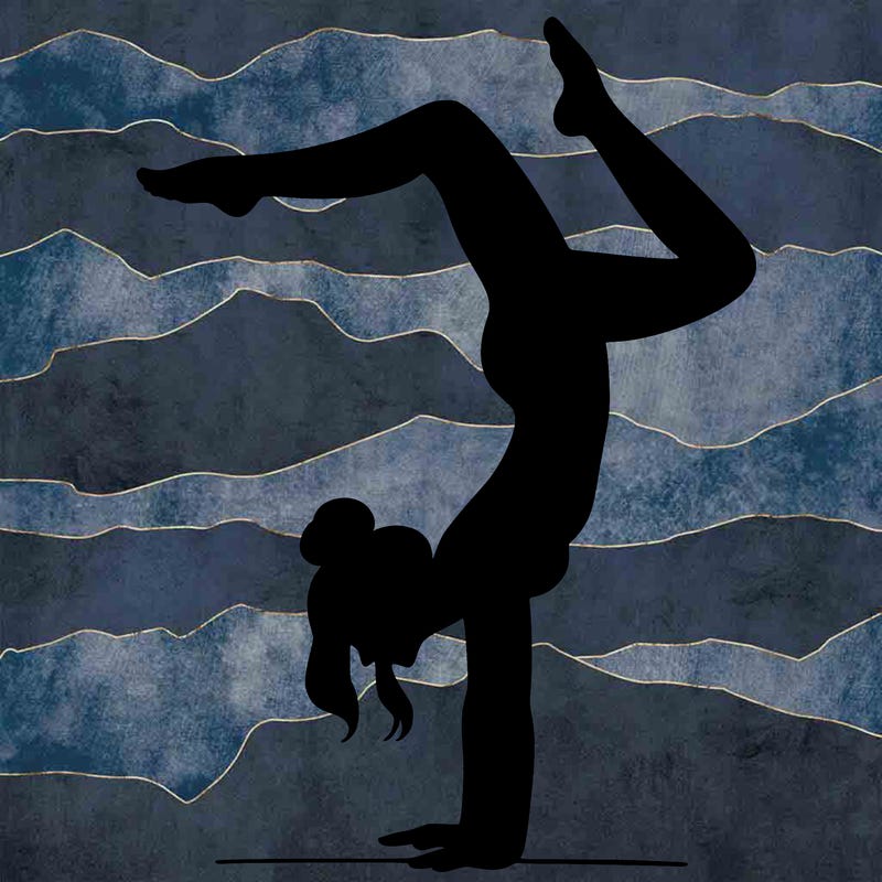 a woman doing a handstand