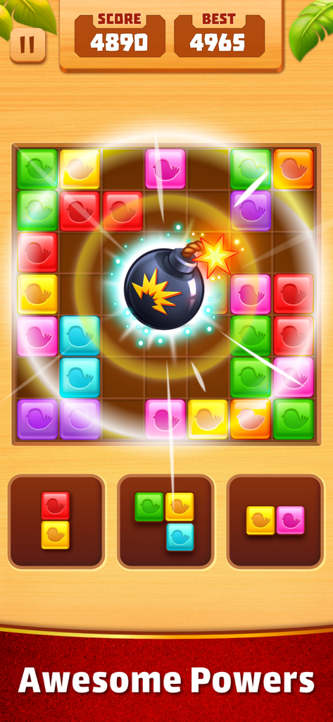 Match Tiles: Block Puzzle Game - Écran de jeu de Match Tiles Block Puzzle montrant un booster bombe dégageant des blocs d'oiseaux colorés.