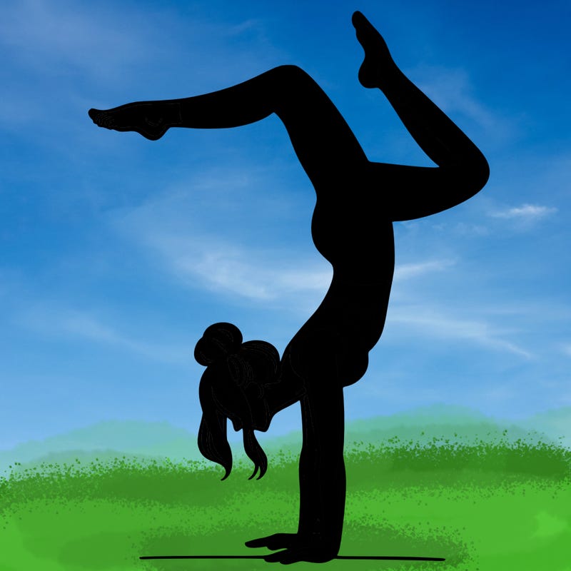 a woman doing a handstand