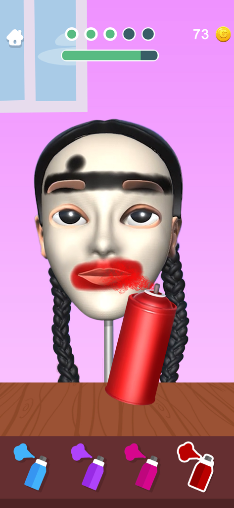 A 3D sculpted clay head being colored with a red spray paint can in the Sculpt People game.