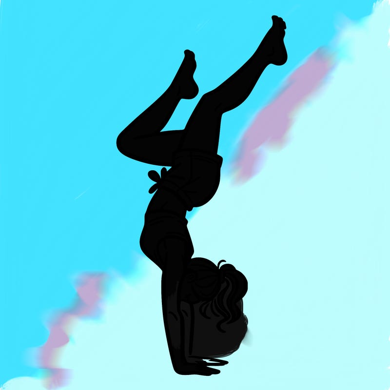 woman doing a hand stand