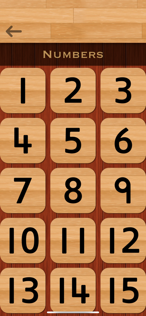 Una pantalla que muestra una cuadrícula de números del uno al quince en fichas de madera para practicar la escritura hindi.