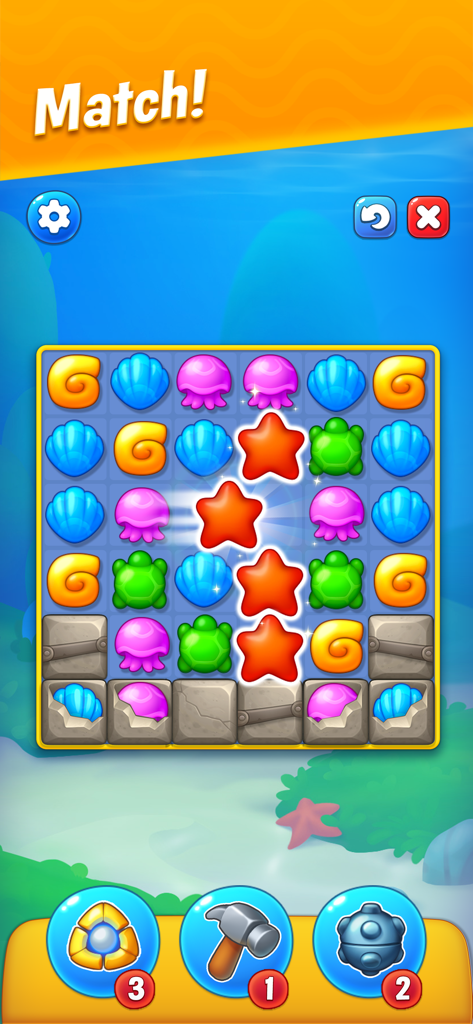Fishdom - Tablero de puzle match-3 de Fishdom con coloridas piezas temáticas marinas, incluyendo estrellas de mar y conchas