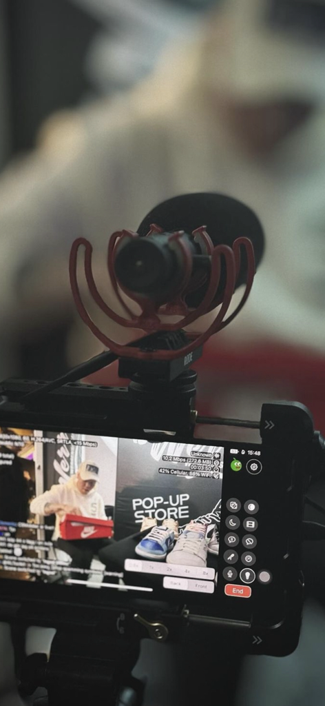 Moblin - Professional mobile live streaming setup featuring the Moblin app on a smartphone with an external microphone
