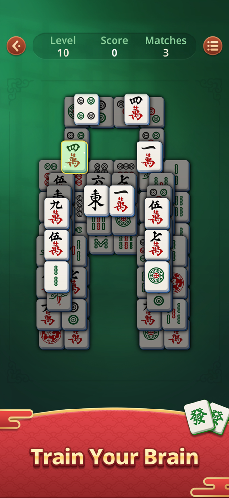 A mahjong solitaire board with traditional tiles on a green background and the text Train Your Brain