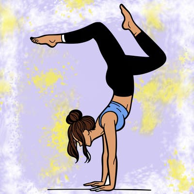 a woman doing a handstand