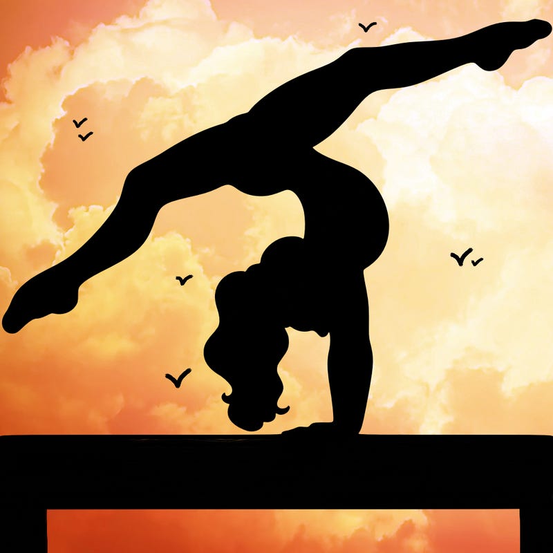 gymnast doing split handstand on a beam