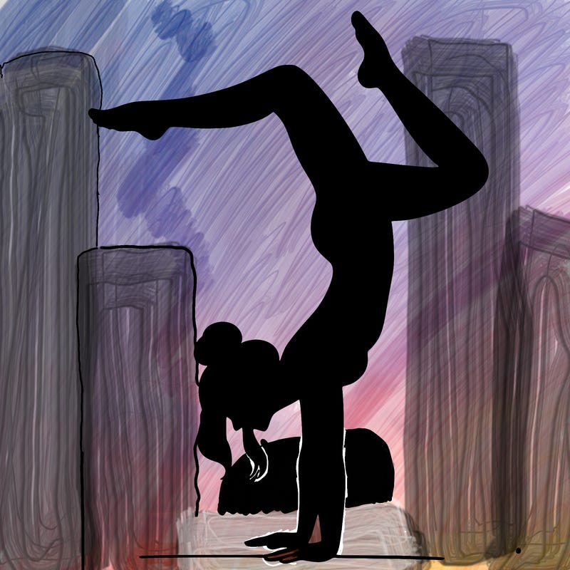 a woman doing a handstand