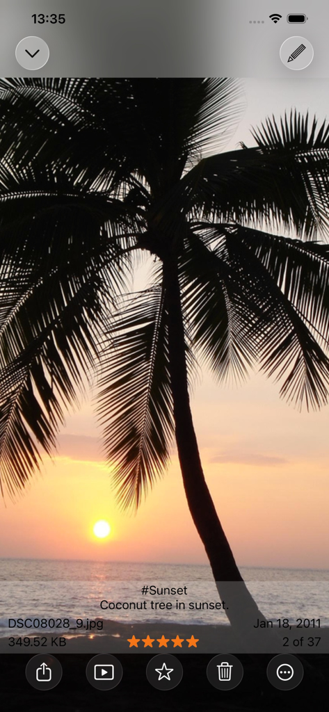 A sunset photo displayed in Photo Manager Pro showing file details star ratings and editing options