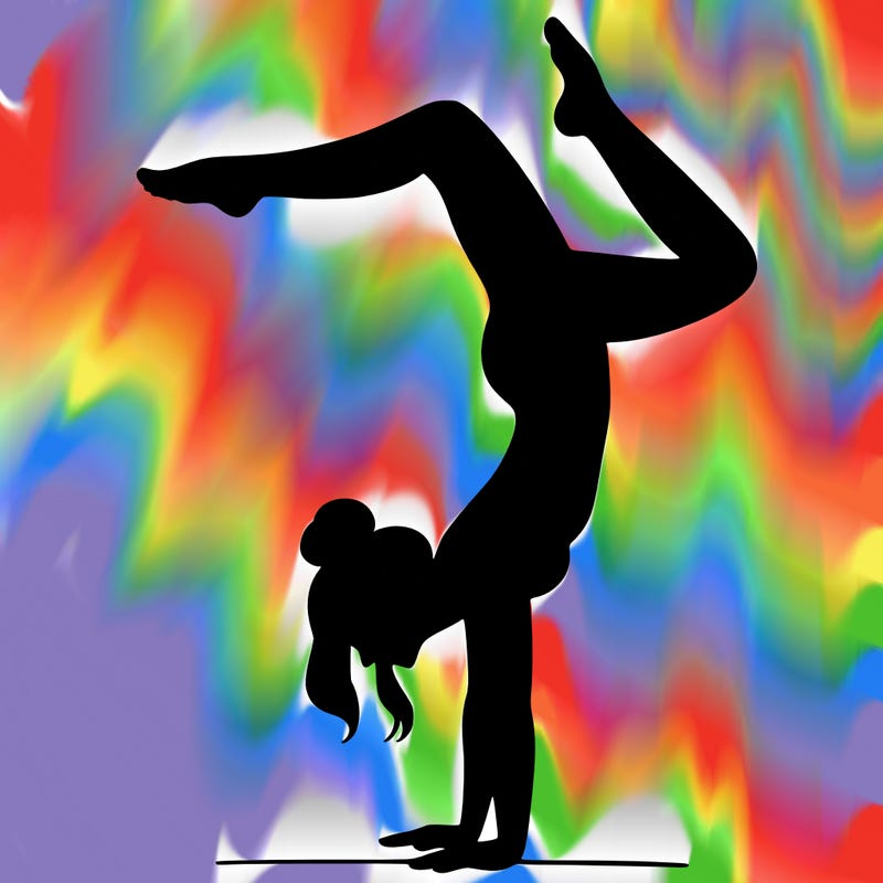 a woman doing a handstand