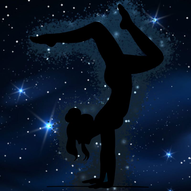 a woman doing a handstand