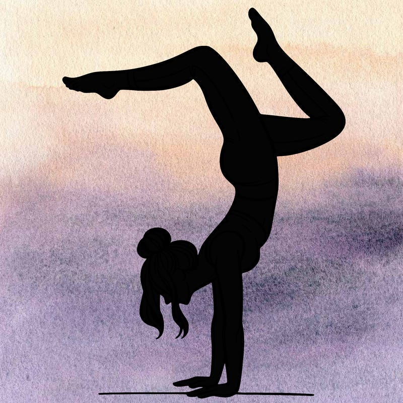 a woman doing a handstand