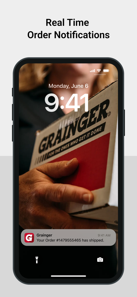 iPhone lock screen displaying a real time shipping notification from the Grainger mobile app