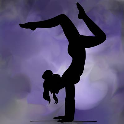 a woman doing a handstand