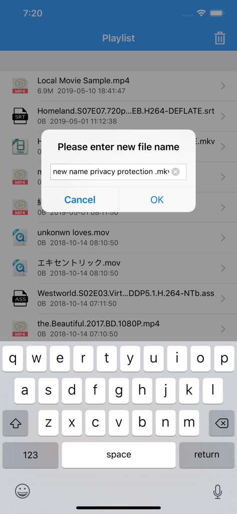 A screenshot of the X Player app showing a pop up dialog to rename a video file within the playlist view