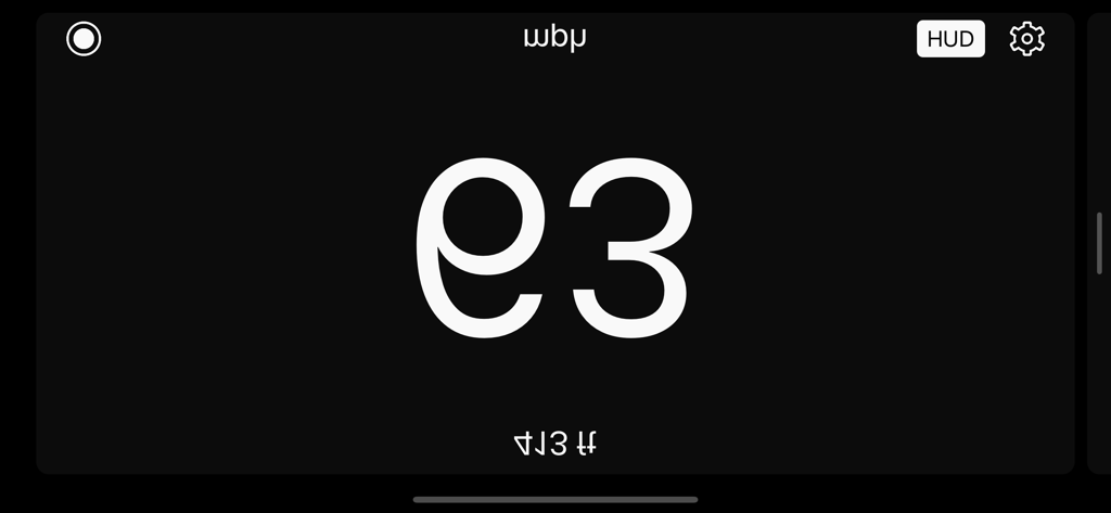 Mirrored Head-Up Display mode showing speed and distance in large font for windshield projection